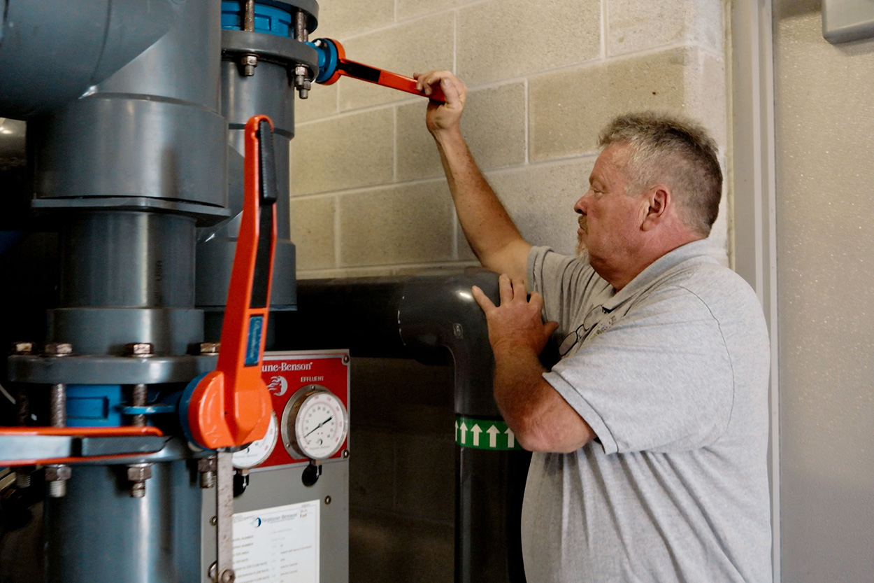 Maintenance Worker with Water Temperature Controls